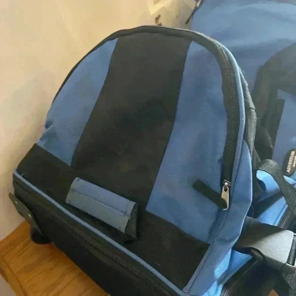 Adventure brand cargo travel‎ bag 30”L with several zipper pockets and wheels